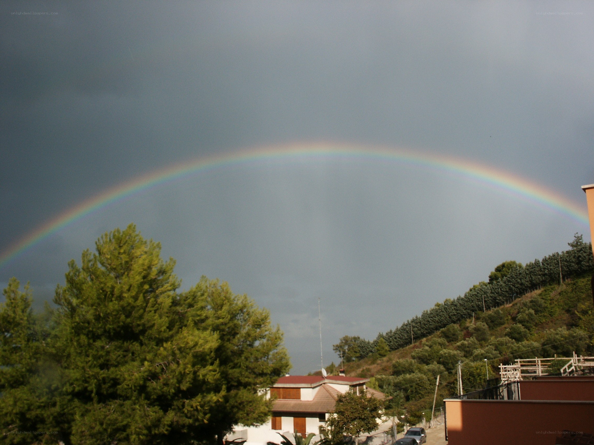 Rainbow over a hillside town