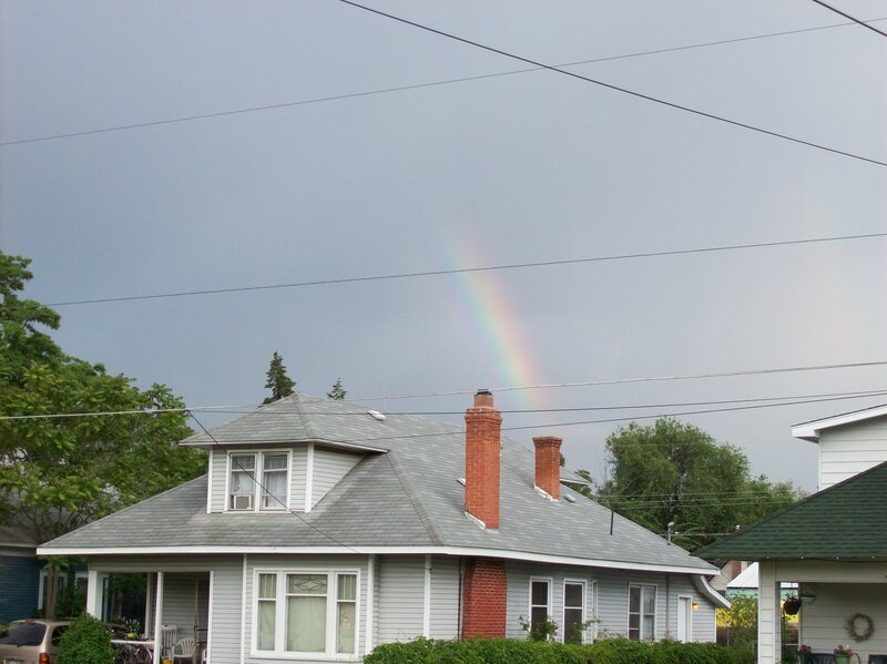 Rainbow over a house