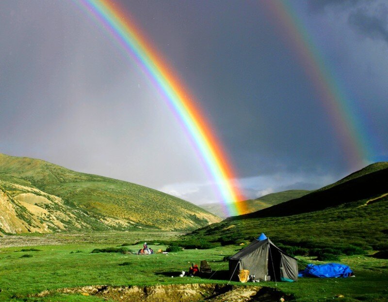 Rainbow over a mountain campsite