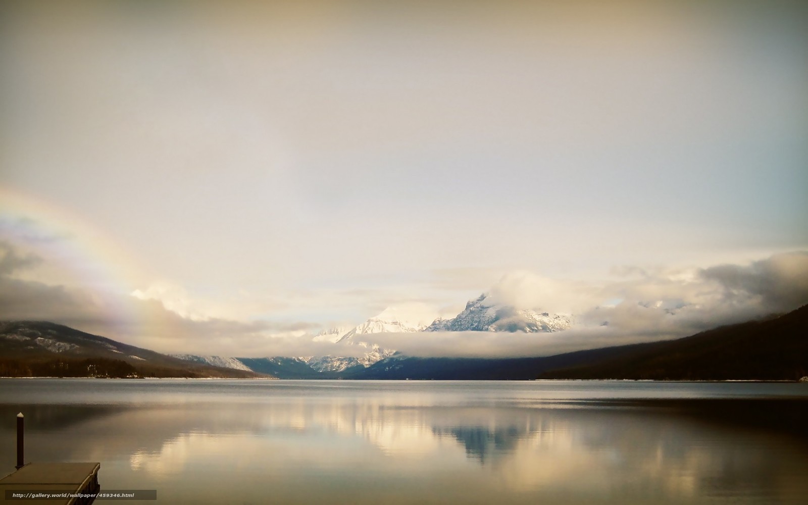 Rainbow over a mountain lake