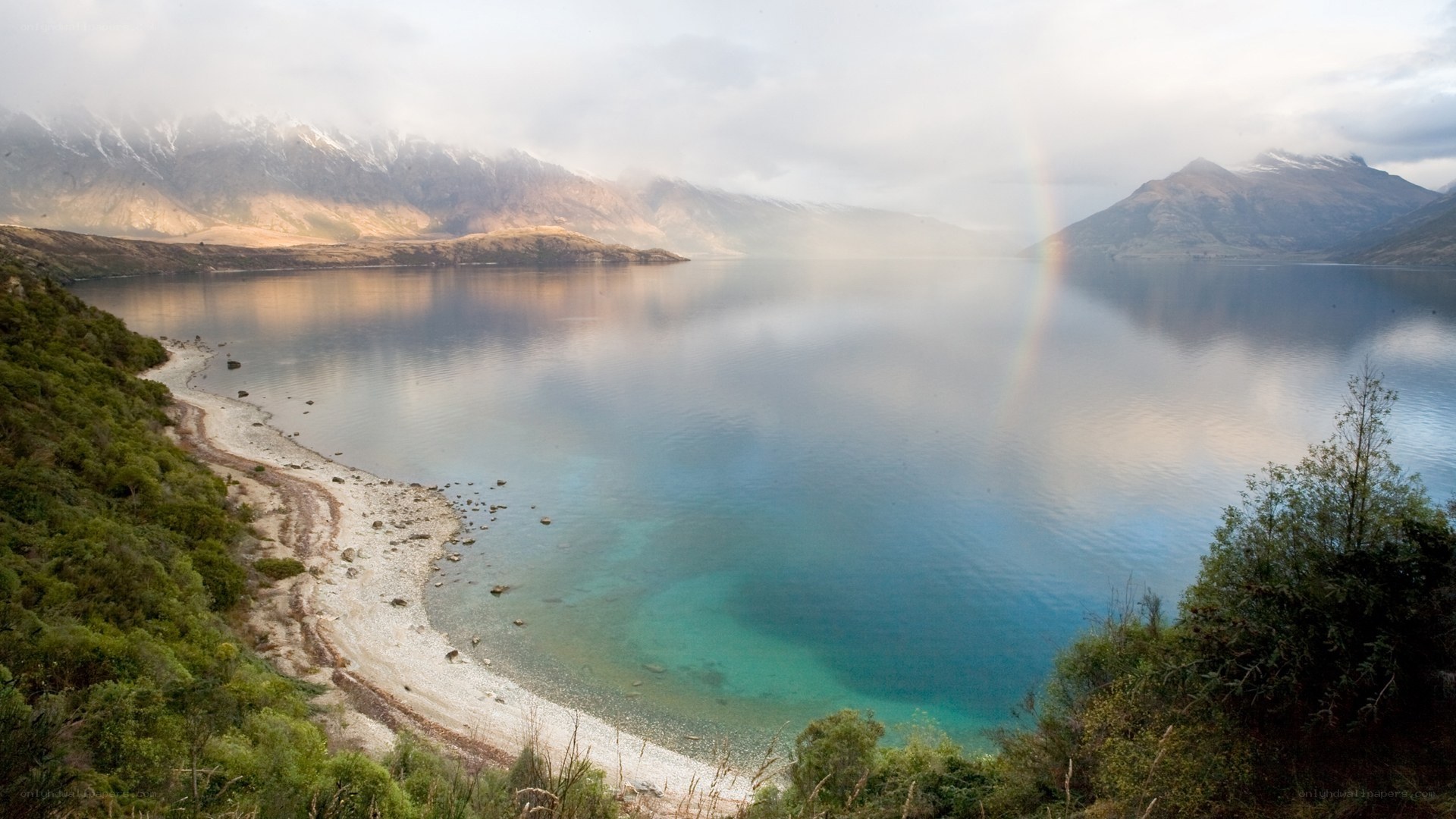 rainbow over a mountain lake