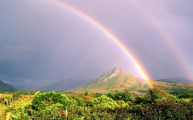 Rainbow over a mountain landscape
