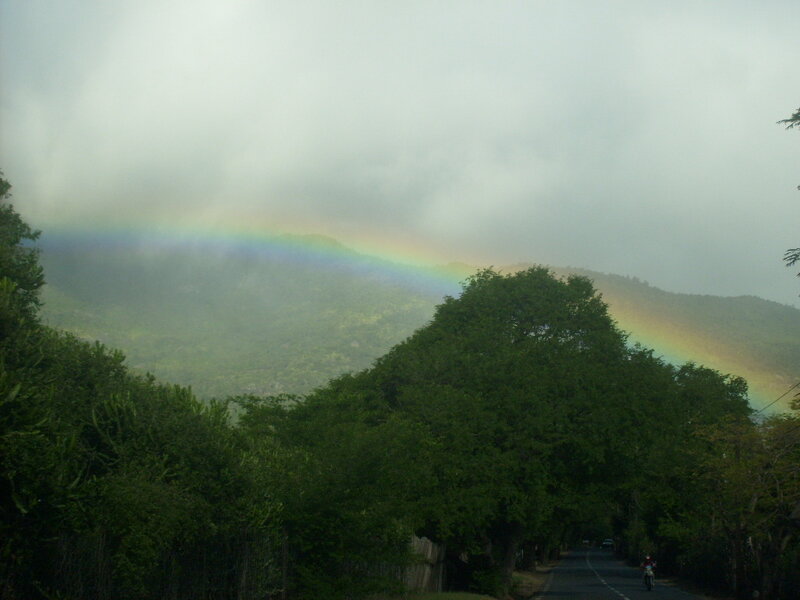 Rainbow over a mountain road