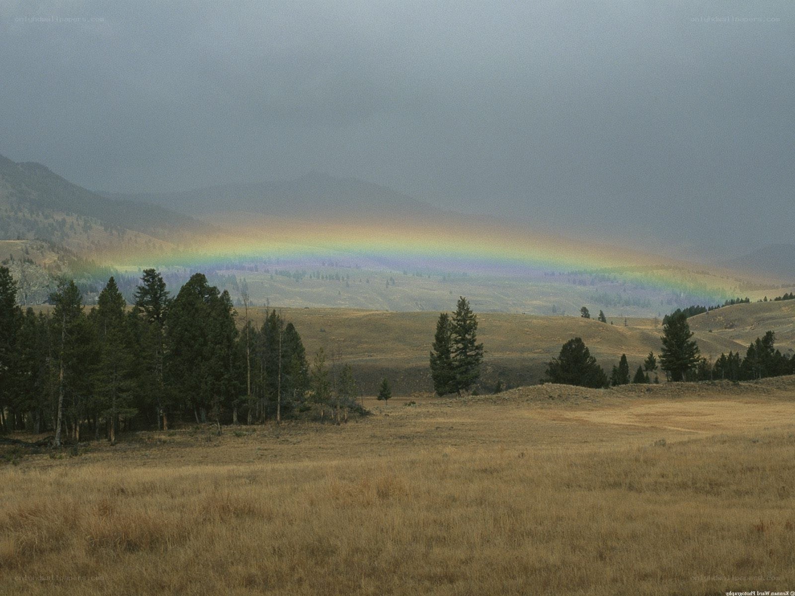 Rainbow over a mountain valley