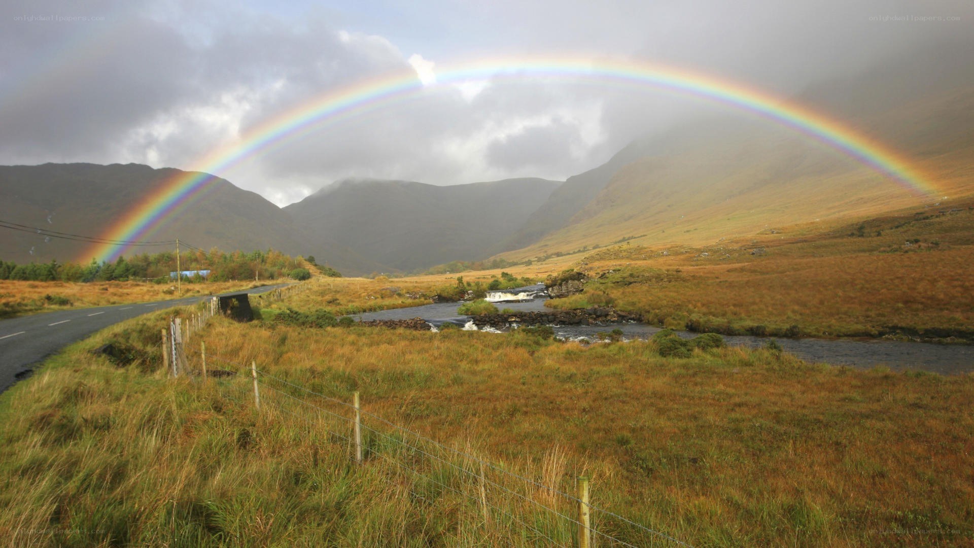 Rainbow over a mountain valley