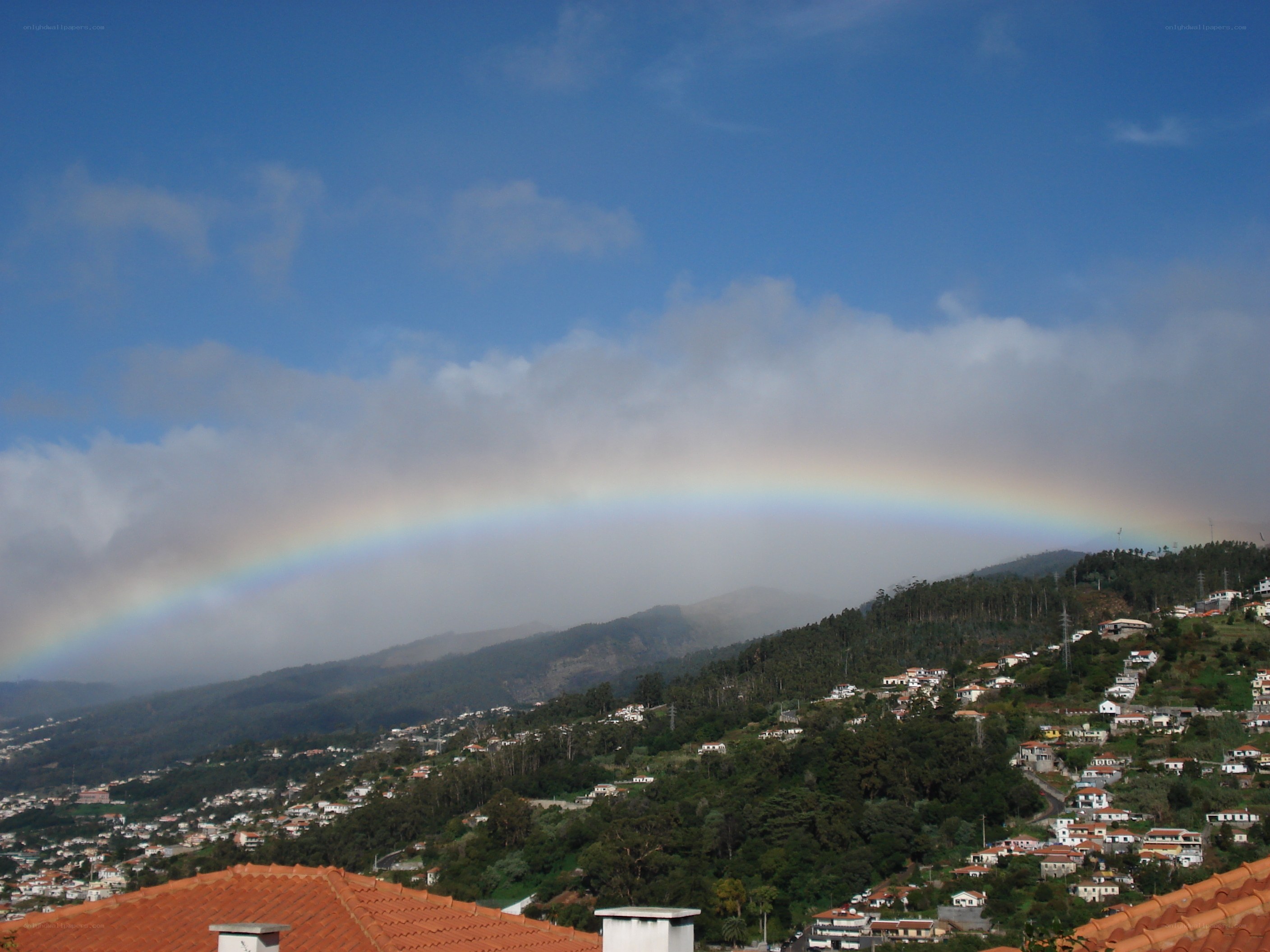 Rainbow over a mountain village