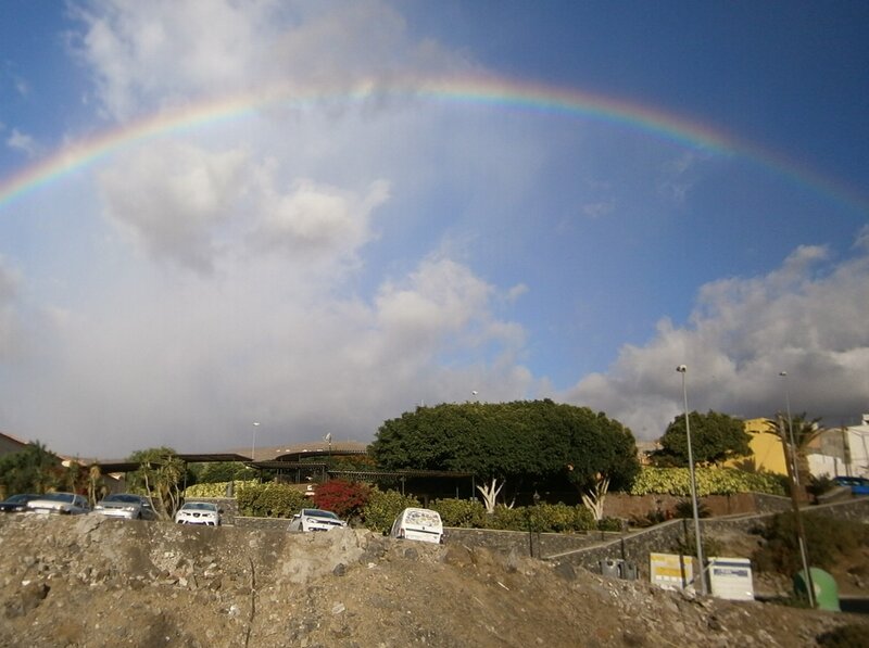 Rainbow over a parking lot