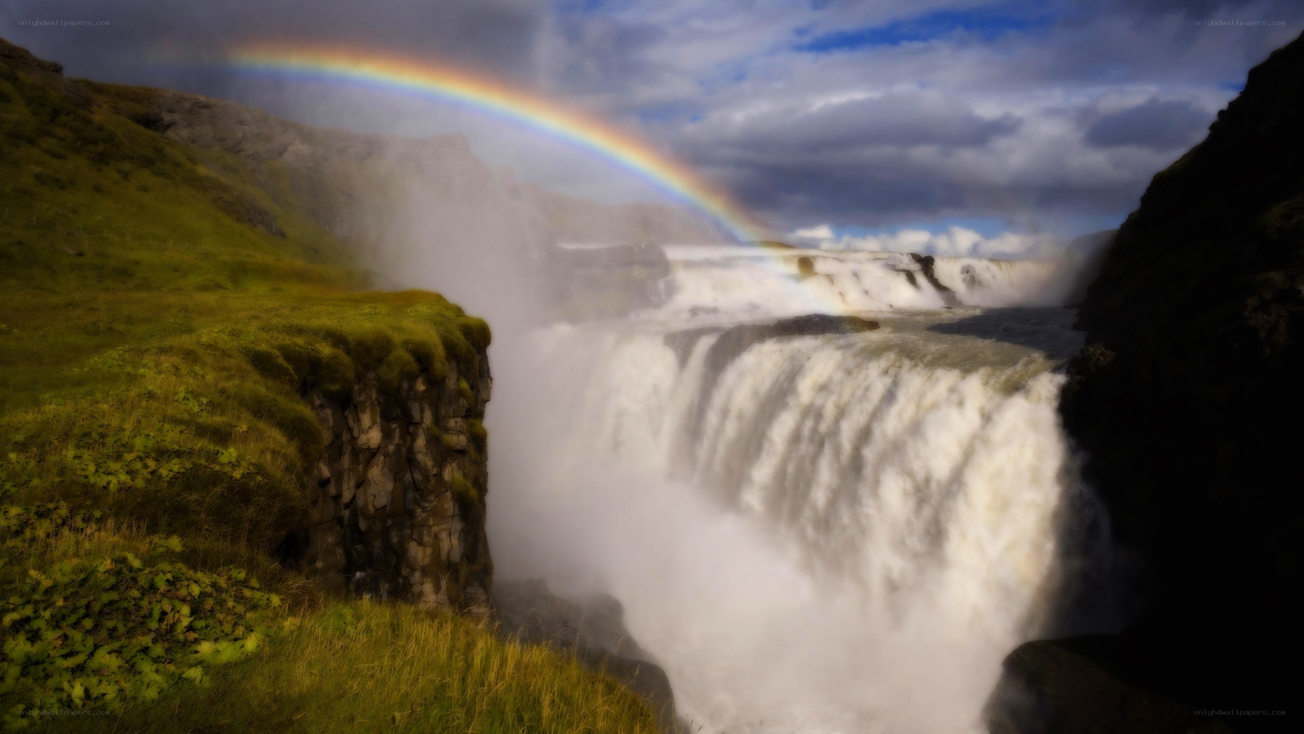 Rainbow over a powerful waterfall