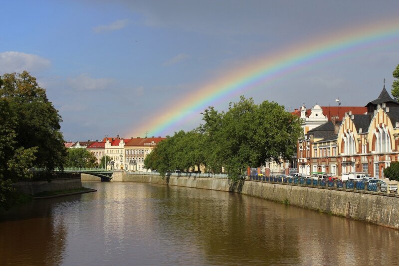 Rainbow over a river city