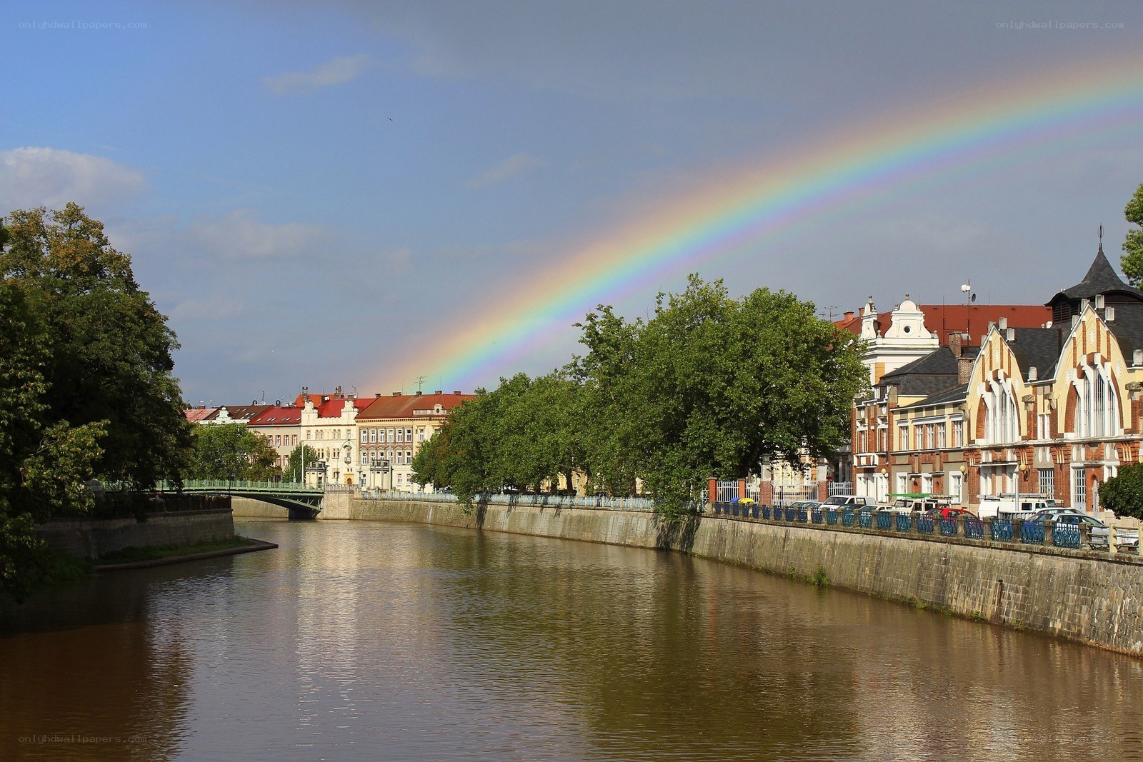 Rainbow over a river city