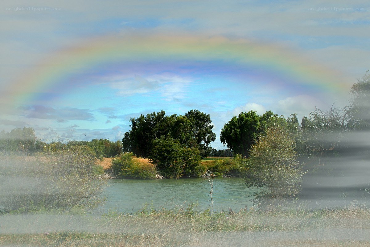 Rainbow over a river landscape