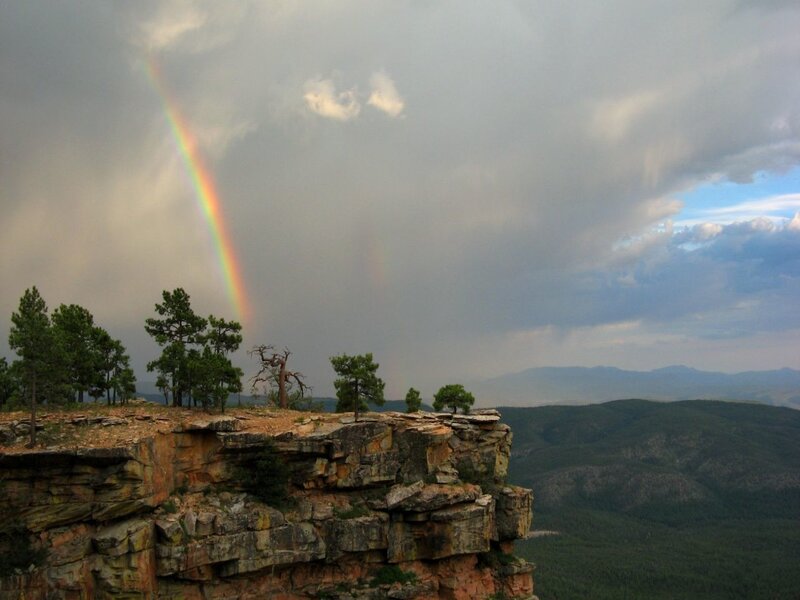 Rainbow over a rocky cliff