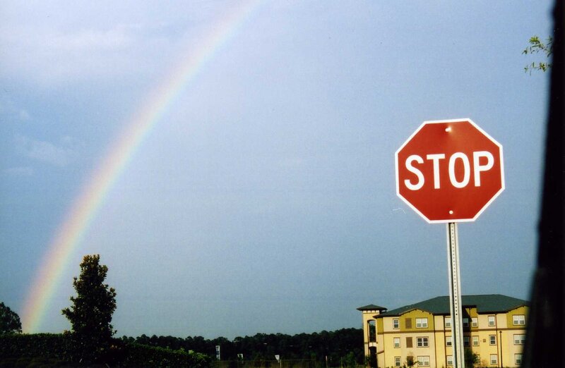 Rainbow over a stop sign