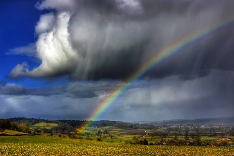 Rainbow over a stormy landscape