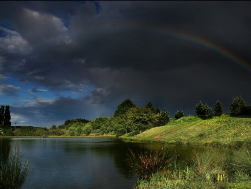 Rainbow over a tranquil lake