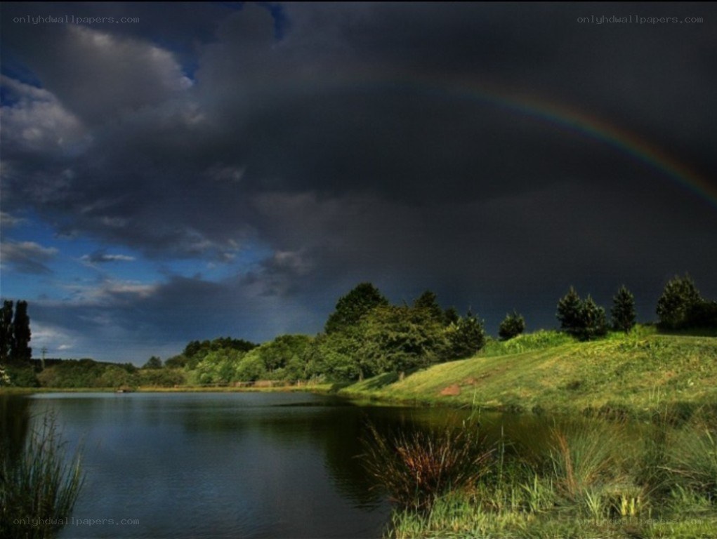 Rainbow over a tranquil lake