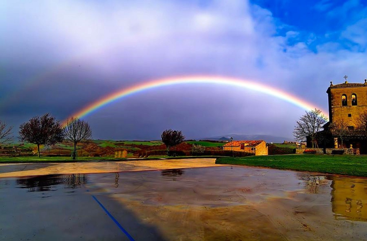 Rainbow over a village