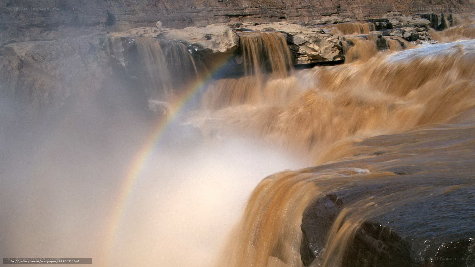 Rainbow over a waterfall