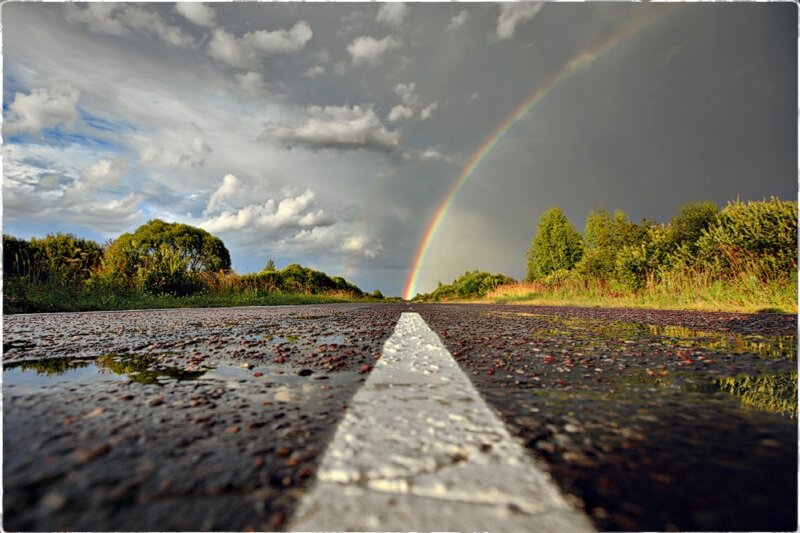 Rainbow over a wet road