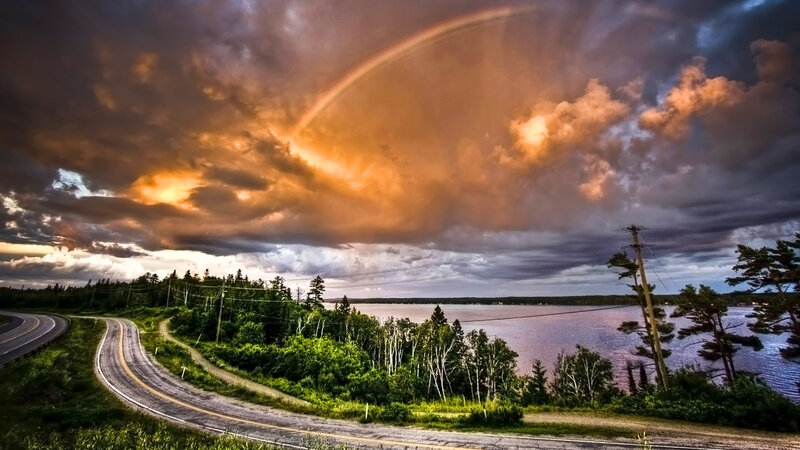 Rainbow over a winding road