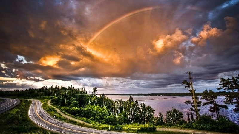 Rainbow over a winding road