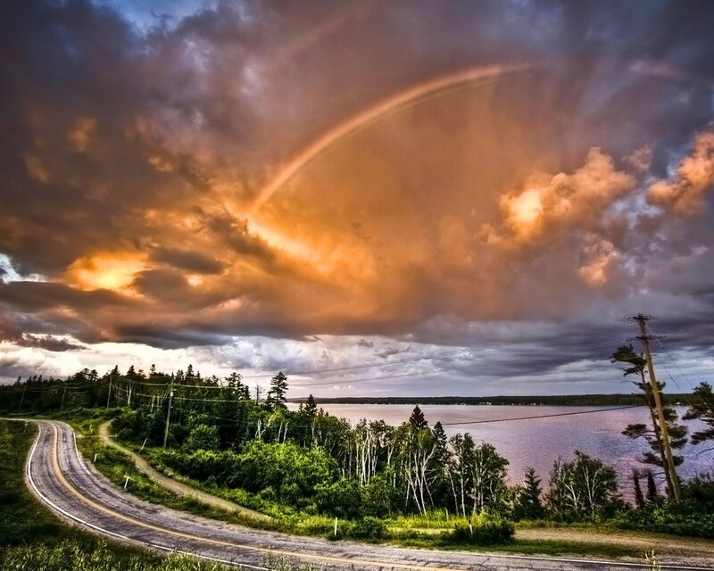 Rainbow over a winding road