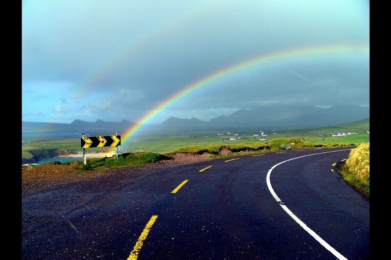 Rainbow over a winding road