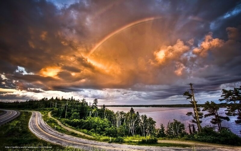 Rainbow over a winding road