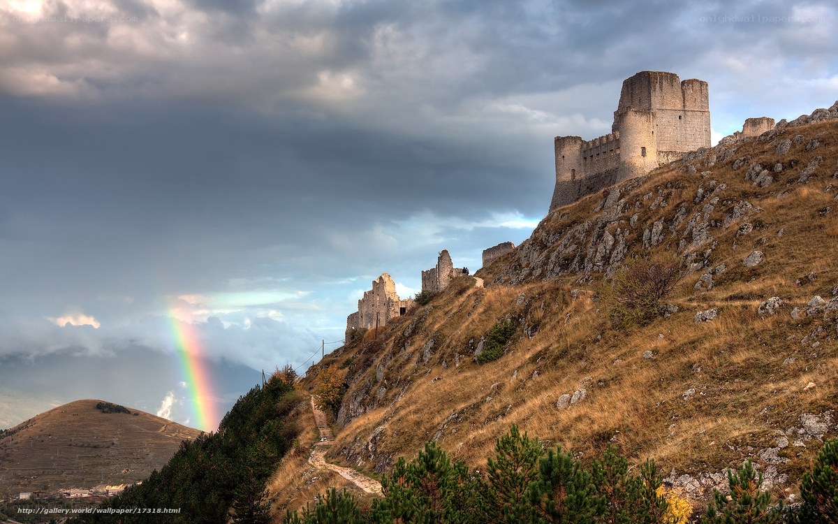 Rainbow over ancient castle ruins