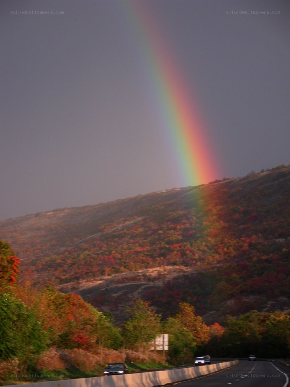 Rainbow over autumn hills