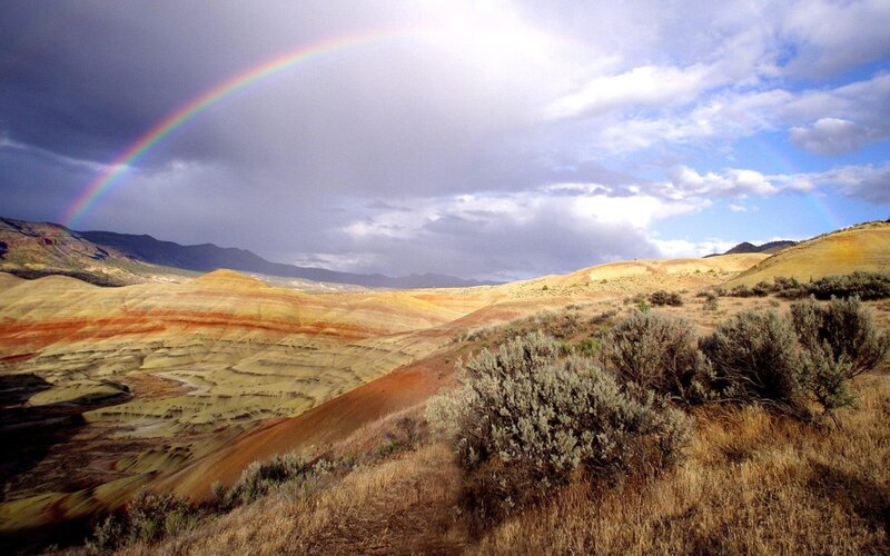Rainbow over Badlands — Brown, Dramatic, Afternoon, Photograph, Mountains, Shrubbery