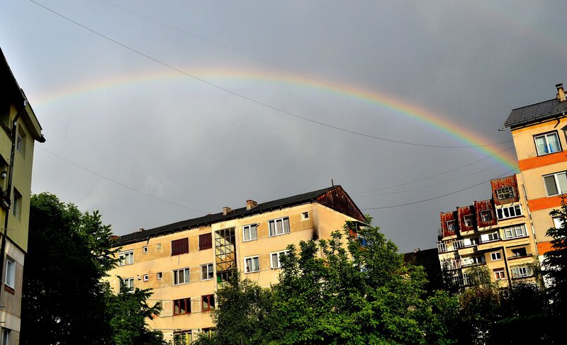 Rainbow over Buildings — Gray, Dramatic, Afternoon, Photograph