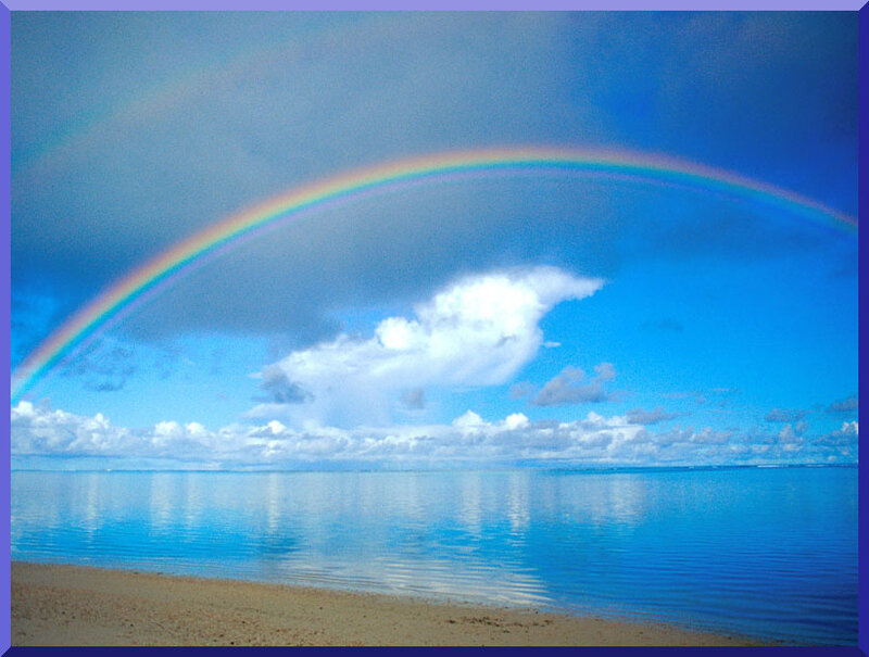 Rainbow over calm ocean