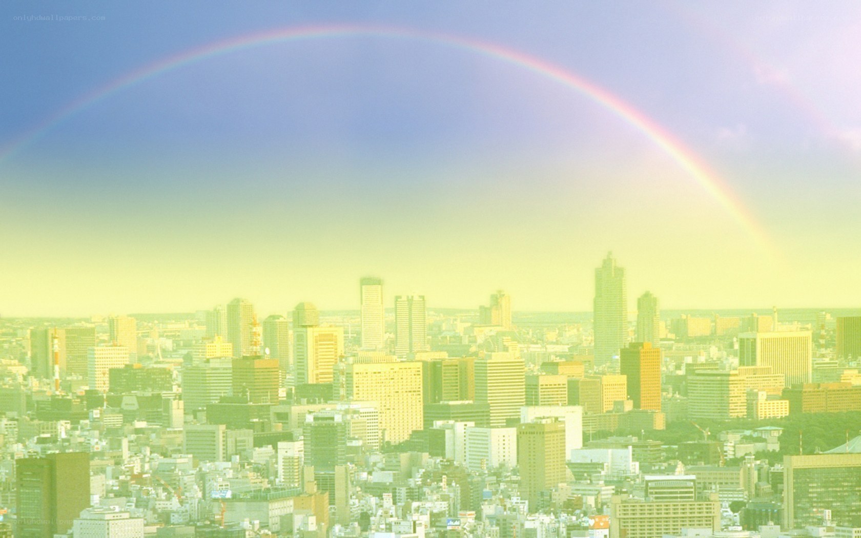 Rainbow over city skyline