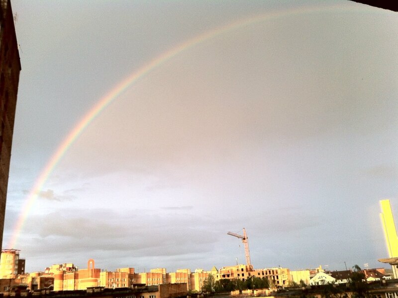 Rainbow over city skyline