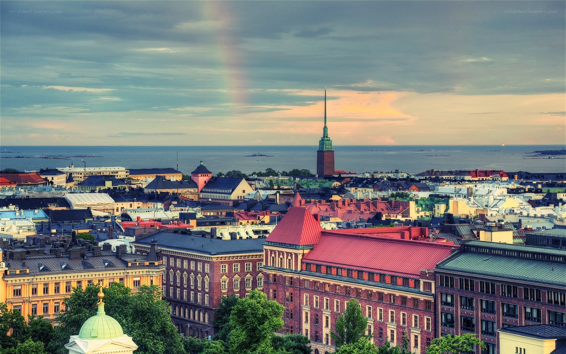 Rainbow over city skyline