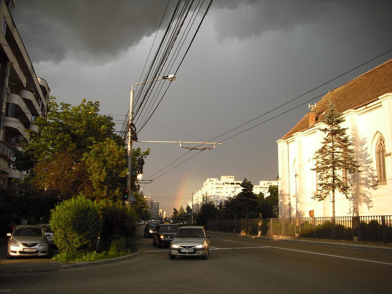 Rainbow over city street