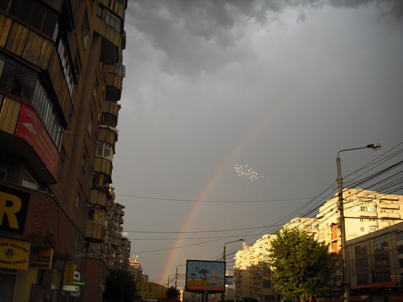 Rainbow over city street