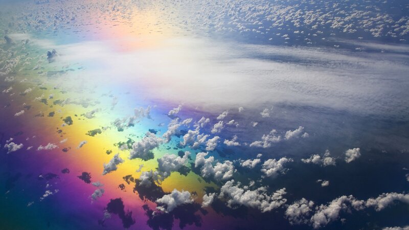 rainbow over clouds from above