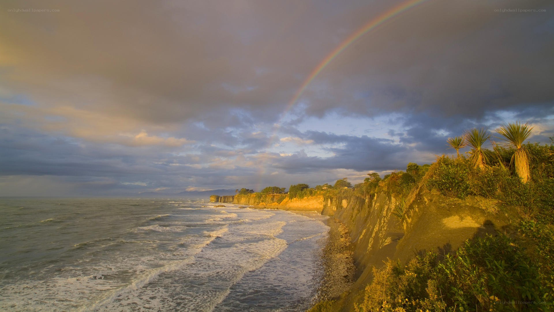 Rainbow over coastal cliffs