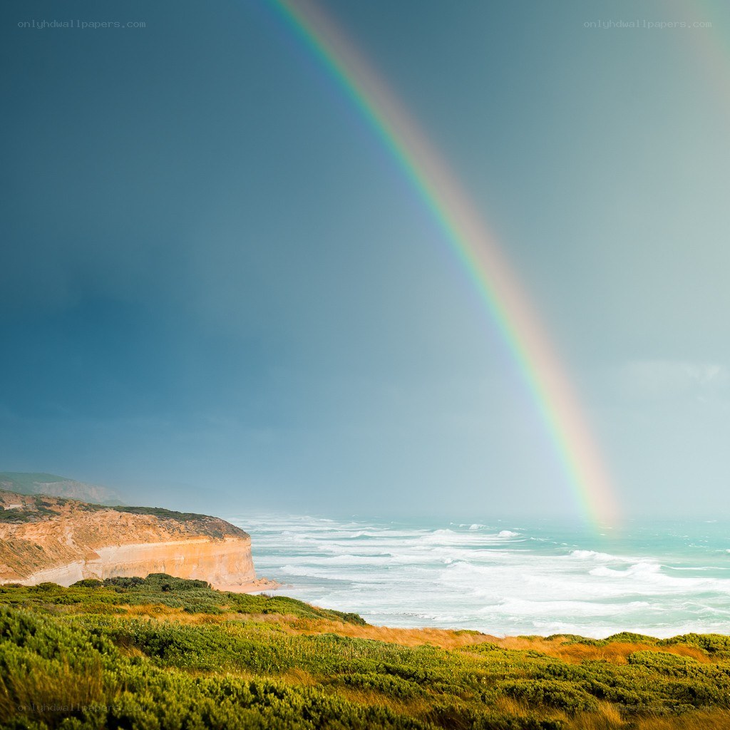 Rainbow over coastal cliffs