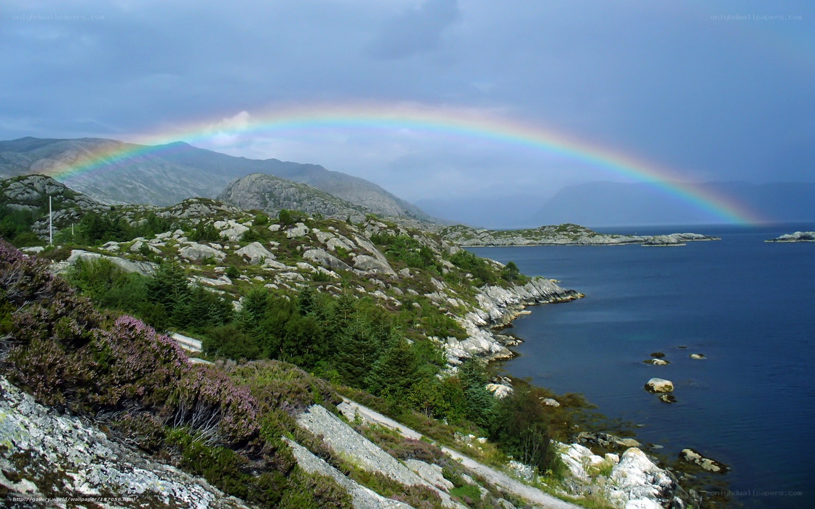 Rainbow over coastal hills