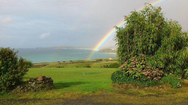 Rainbow over coastal landscape