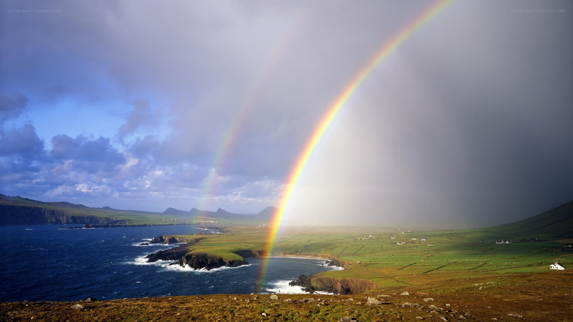 Rainbow over coastal landscape