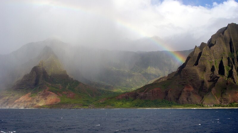 rainbow over coastal mountains
