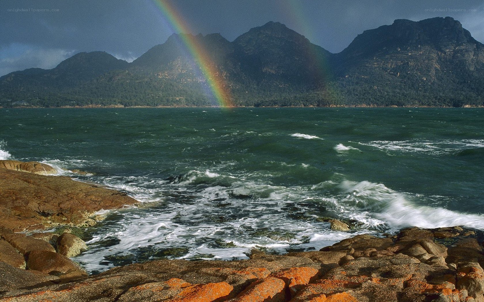 Rainbow over coastal mountains