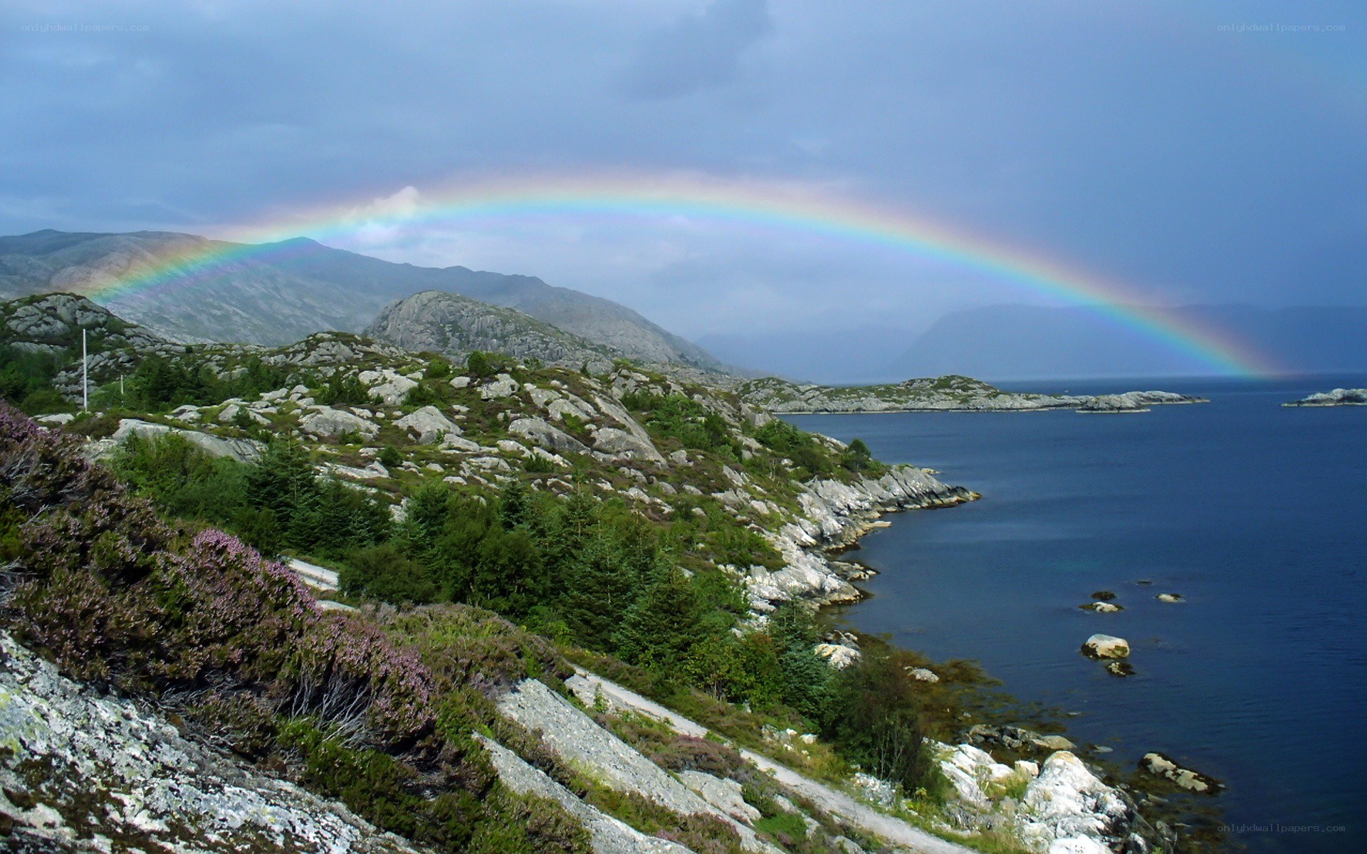 Rainbow over coastal mountains