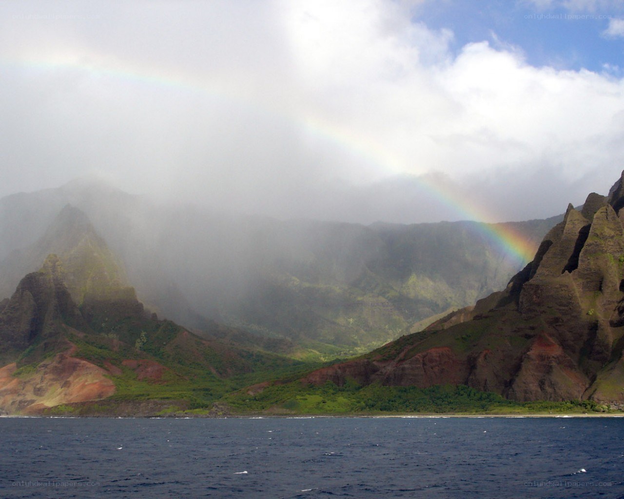 Rainbow over coastal mountains