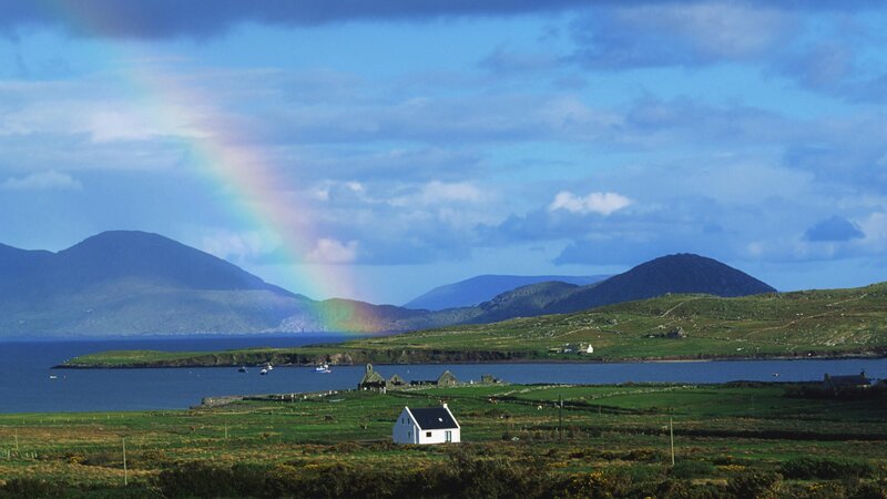 Rainbow over coastal village