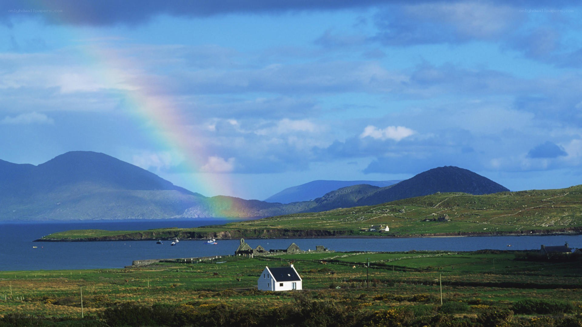 Rainbow over coastal village